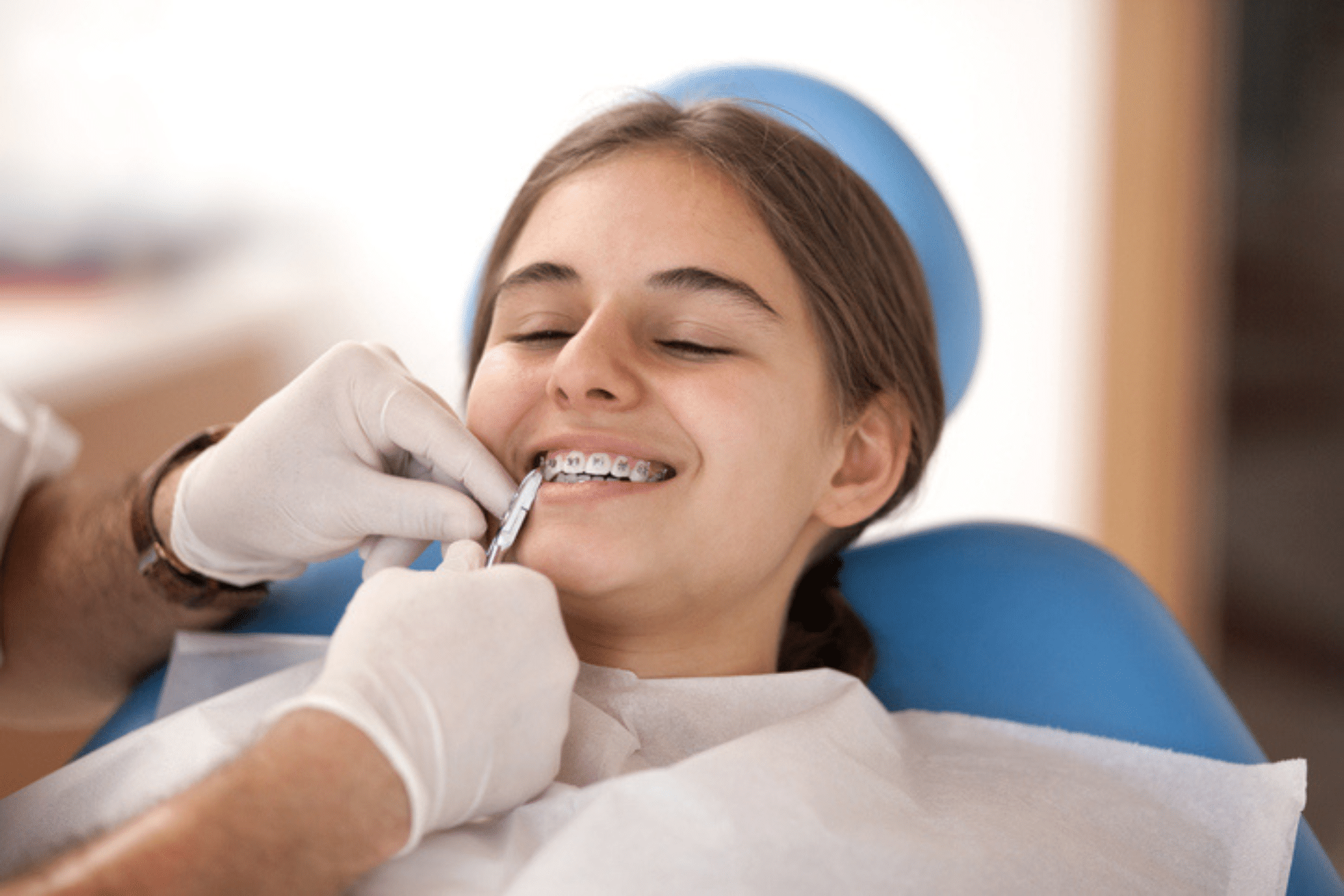 Teen getting braces checked during an orthodontic visit in Middletown, DE