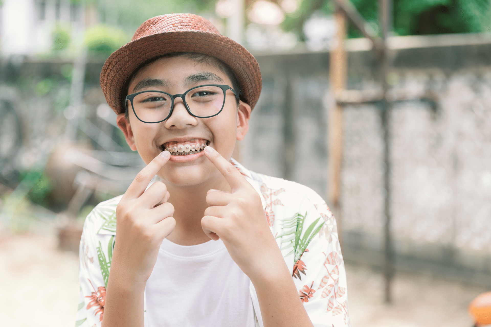 Child smiling with braces while learning why regular orthodontic appointments matter in Middletown DE
